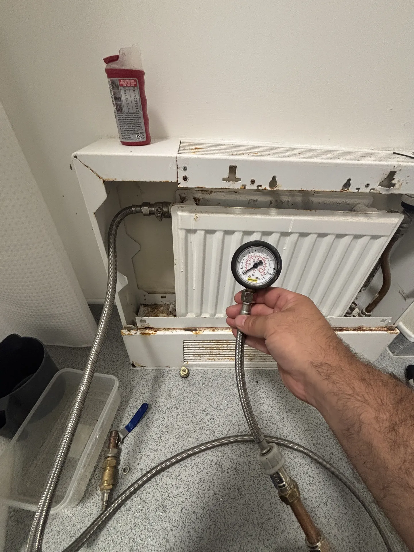 Pressure gauge connected to a radiator to test a central heating system