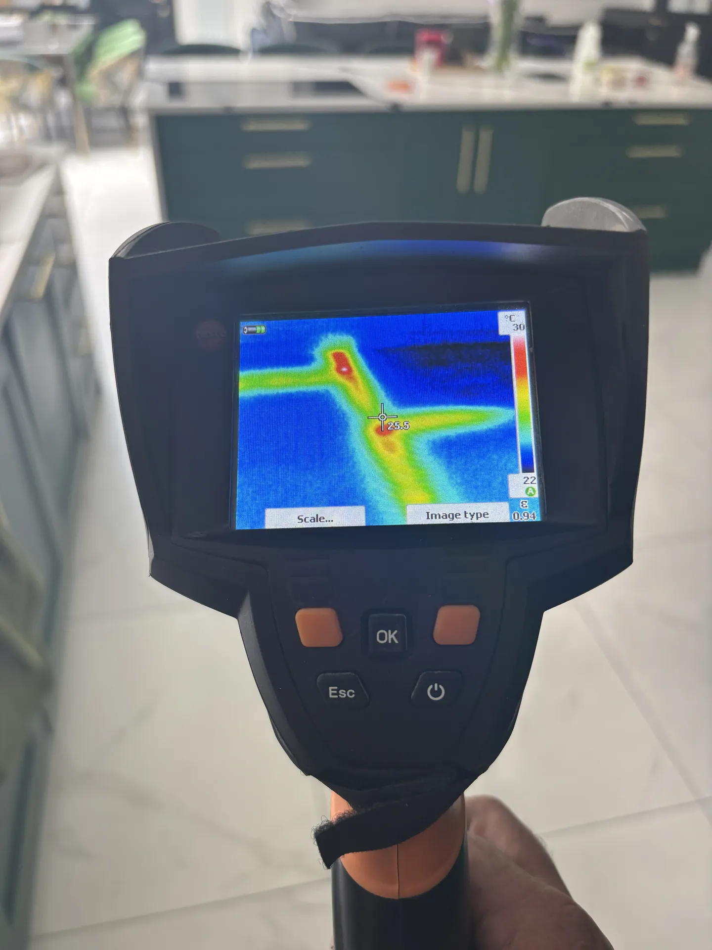 Thermal camera showing a leaking hot pipe under a kitchen floor